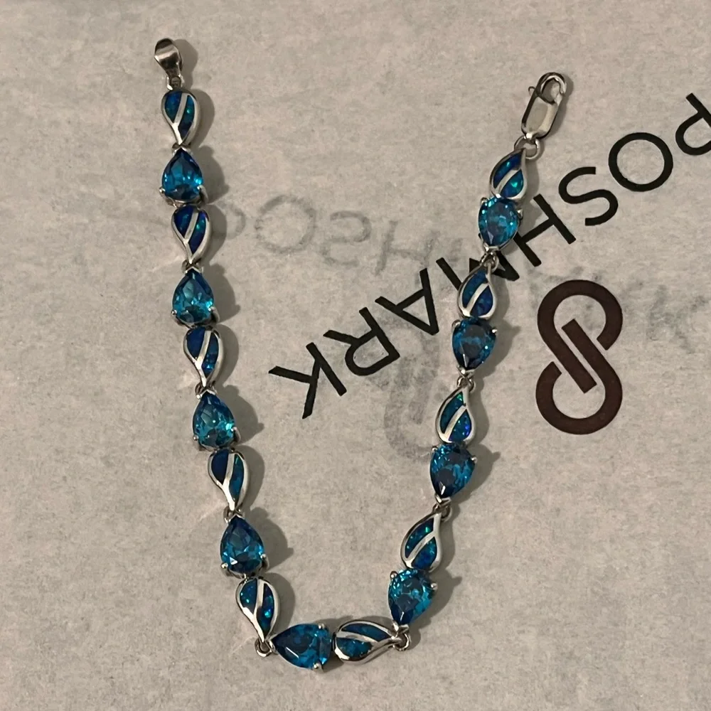 LOVED AUTHENTIC LONDON BLUE TOPAZ STONES/BLUE FIRE OPAL STERLING SILVER BRACELET